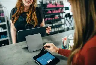 woman holding magnetic card
