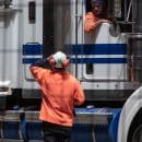 man standing in front of freight truck